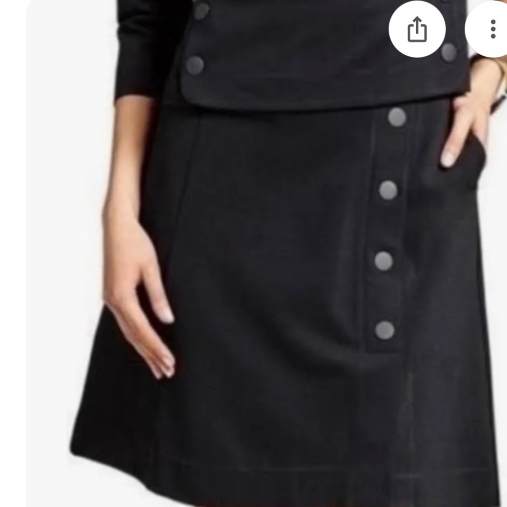 Cabi ponti black mini skirt. zip closure. off center buttons one pocket